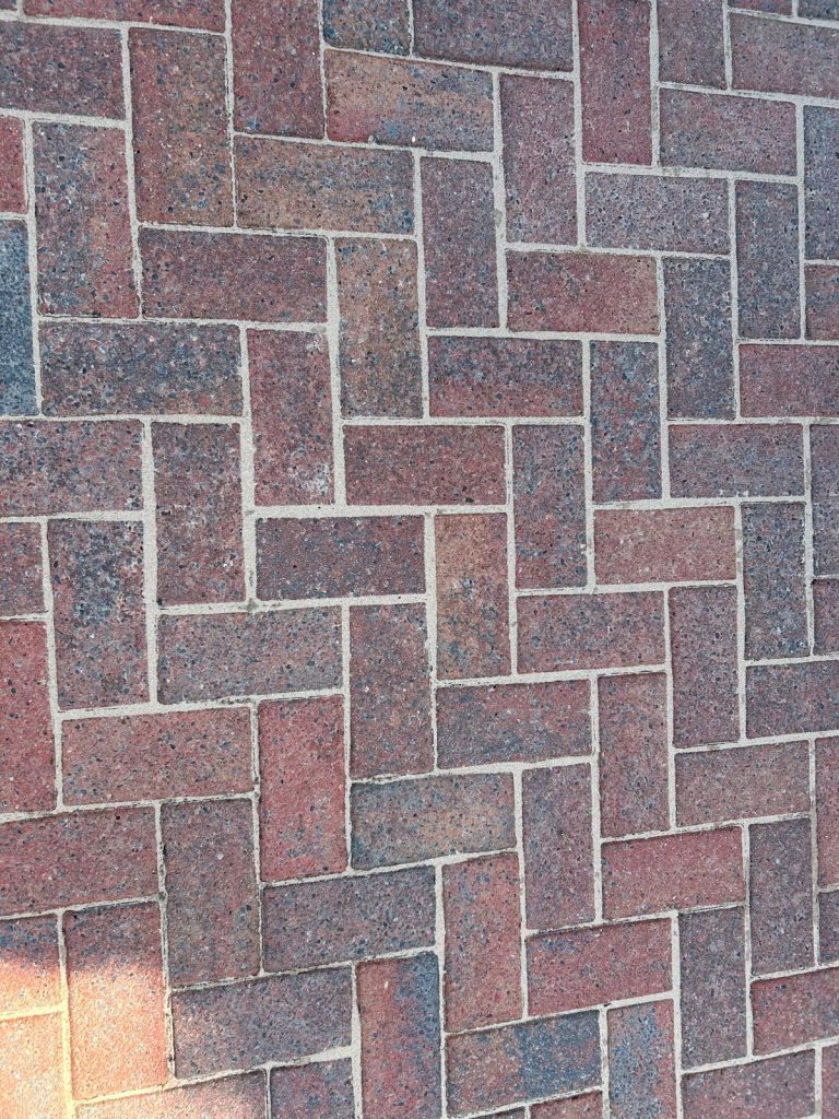 A driveway that has been cleaned by a pressure washer