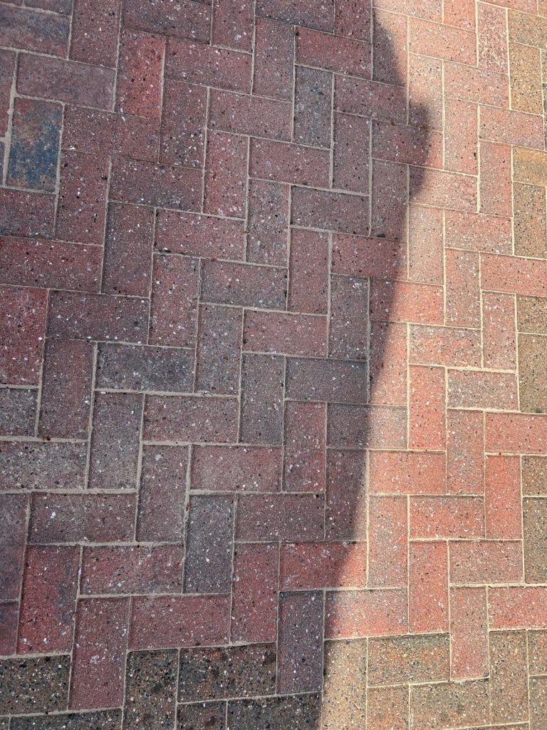 A driveway that has been cleaned by a pressure washer